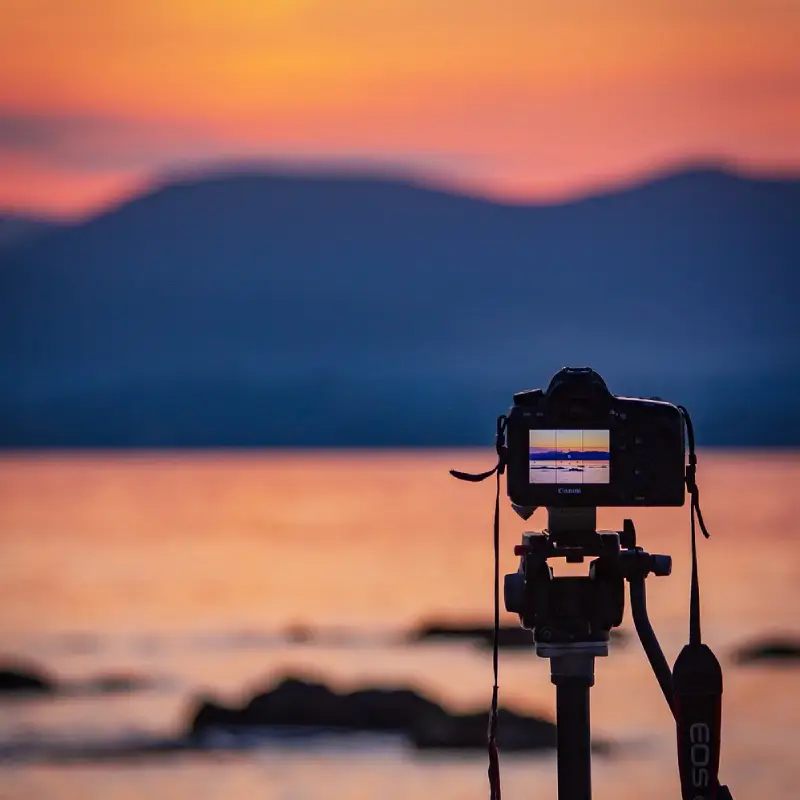 Photographer with cameras